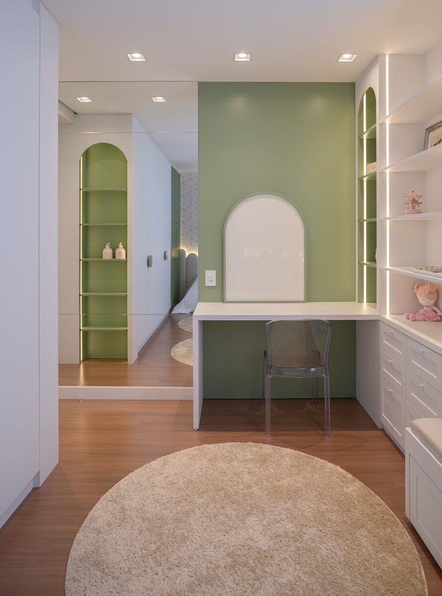 Modern room with desk, shelves, and round rug.