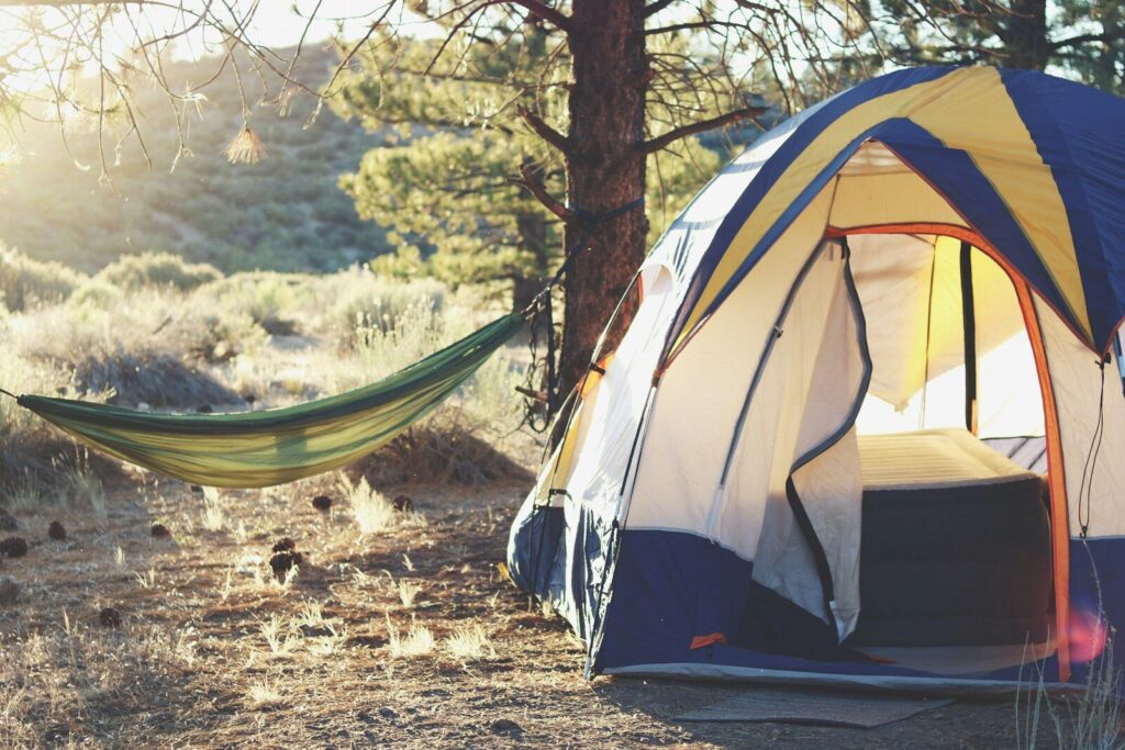 25 Refreshing Things to Do Outside by Yourself 8 white, yellow, and blue dome tent near green hammock