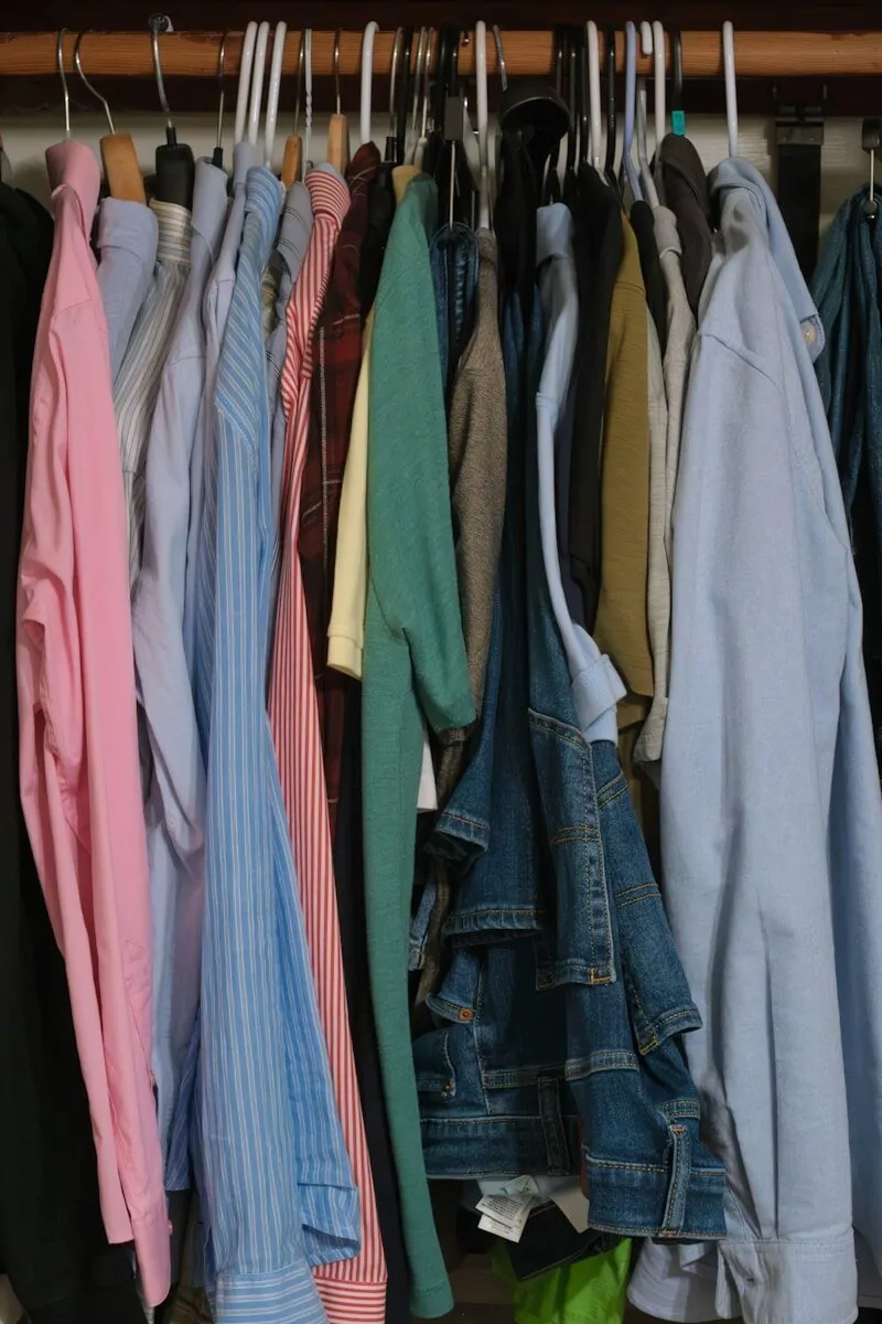 A closet full of neatly hung clothes.