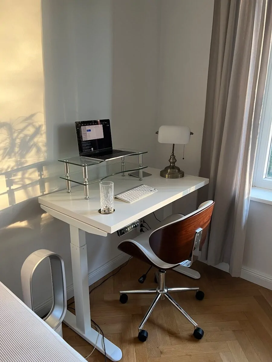 a desk with a computer on it