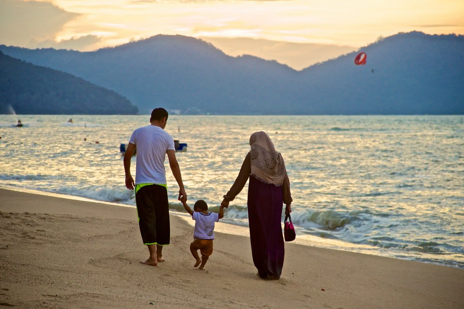 1 Habit That Can Change Your Child’s Entire Future 1 man and woman holding hands while walking on beach during daytime