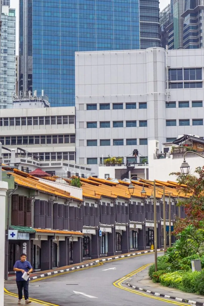 60 Meaningful Things to Do With Your Parents for Every Season and Situation 20 a man walking down a street next to tall buildings