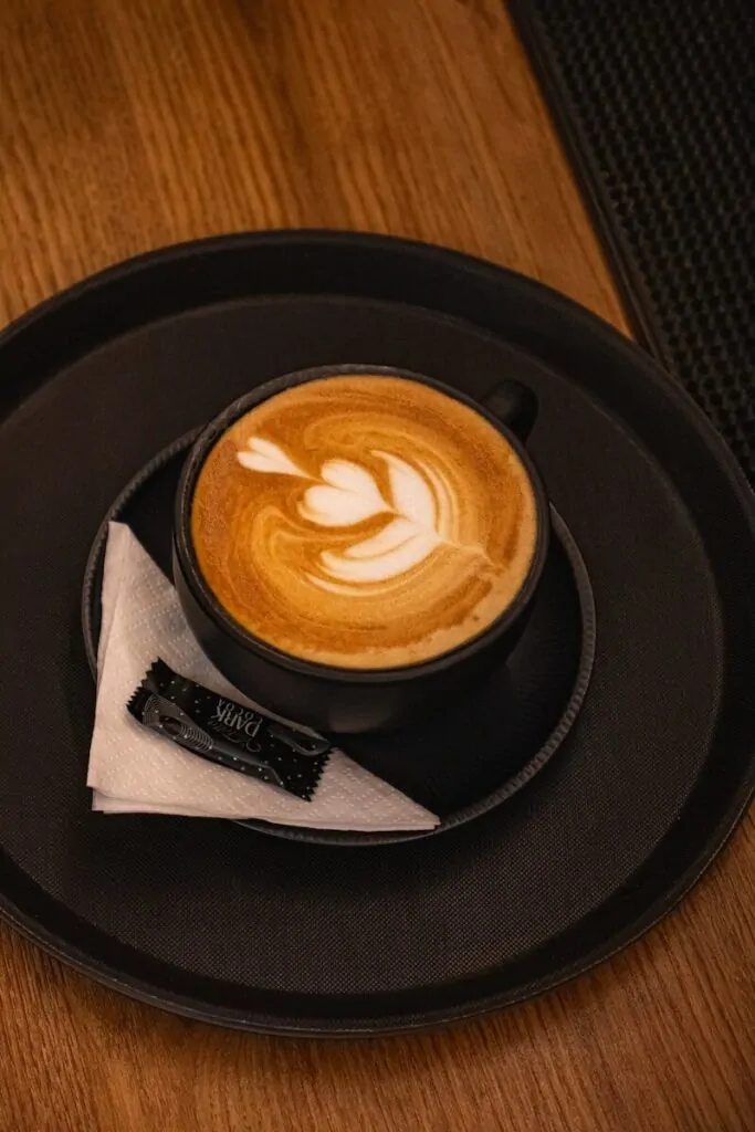 60 Meaningful Things to Do With Your Parents for Every Season and Situation 5 A latte with artful foam design on a tray