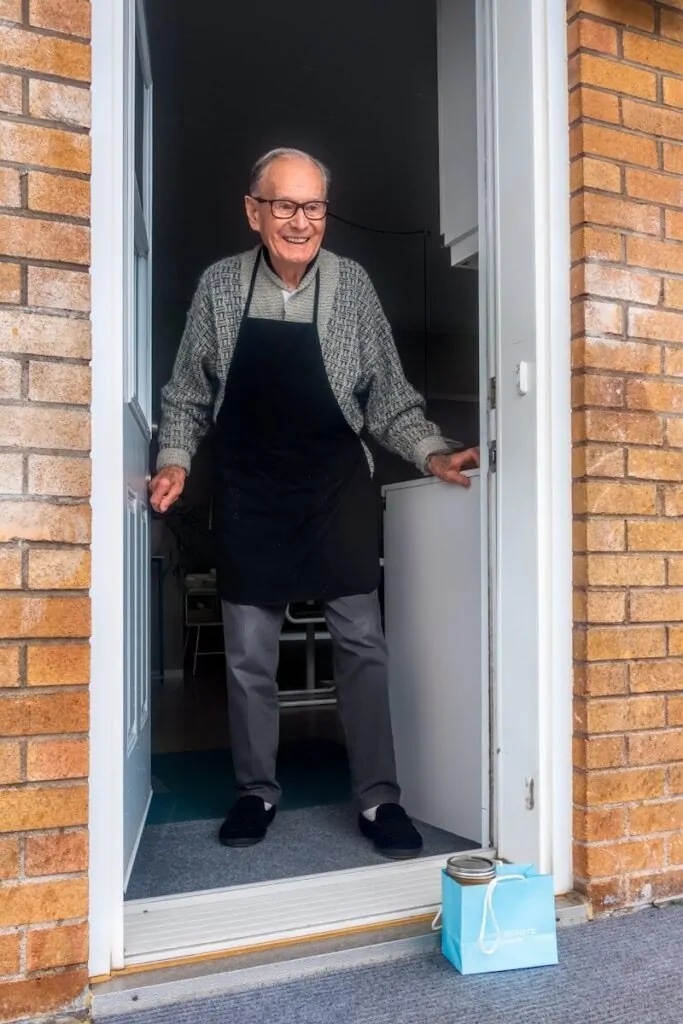 60 Meaningful Things to Do With Your Parents for Every Season and Situation 10 man in black vest and black dress pants standing beside white wooden door