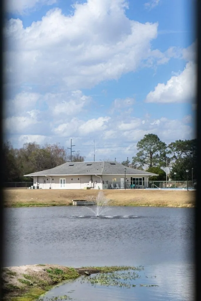 60 Meaningful Things to Do With Your Parents for Every Season and Situation 19 Building with fountain in pond under cloudy sky