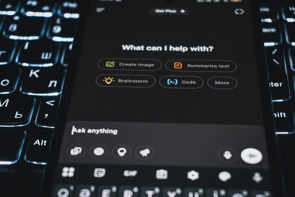 10 AI Business Ideas That Could Explode in 2026 1 A smartphone is showing an ai assistant's interface.
