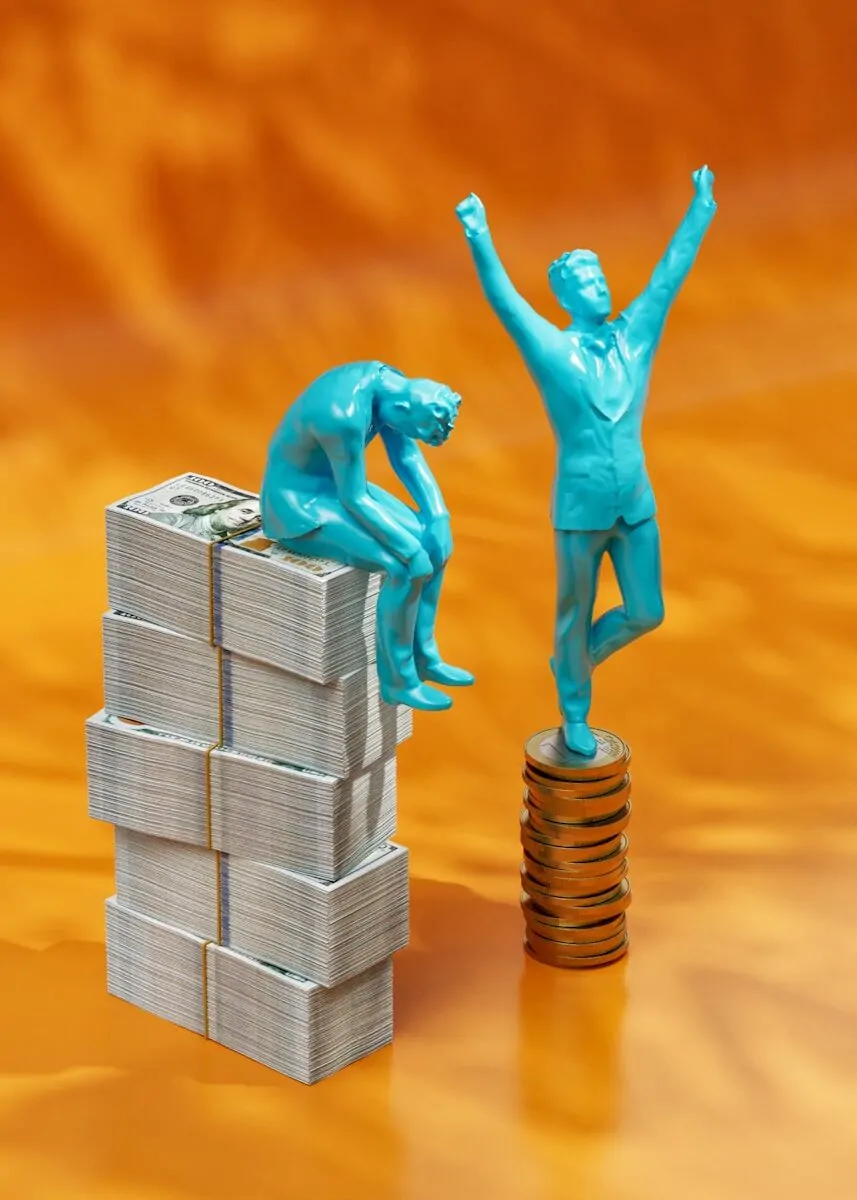 Why Entrepreneurs Aim for Wealth, Not Just Being Rich 2 a statue of a man standing on top of stacks of money