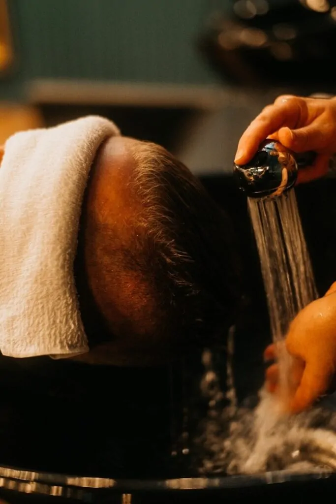 60 Meaningful Things to Do With Your Parents for Every Season and Situation 24 a man getting his hair washed in a sink