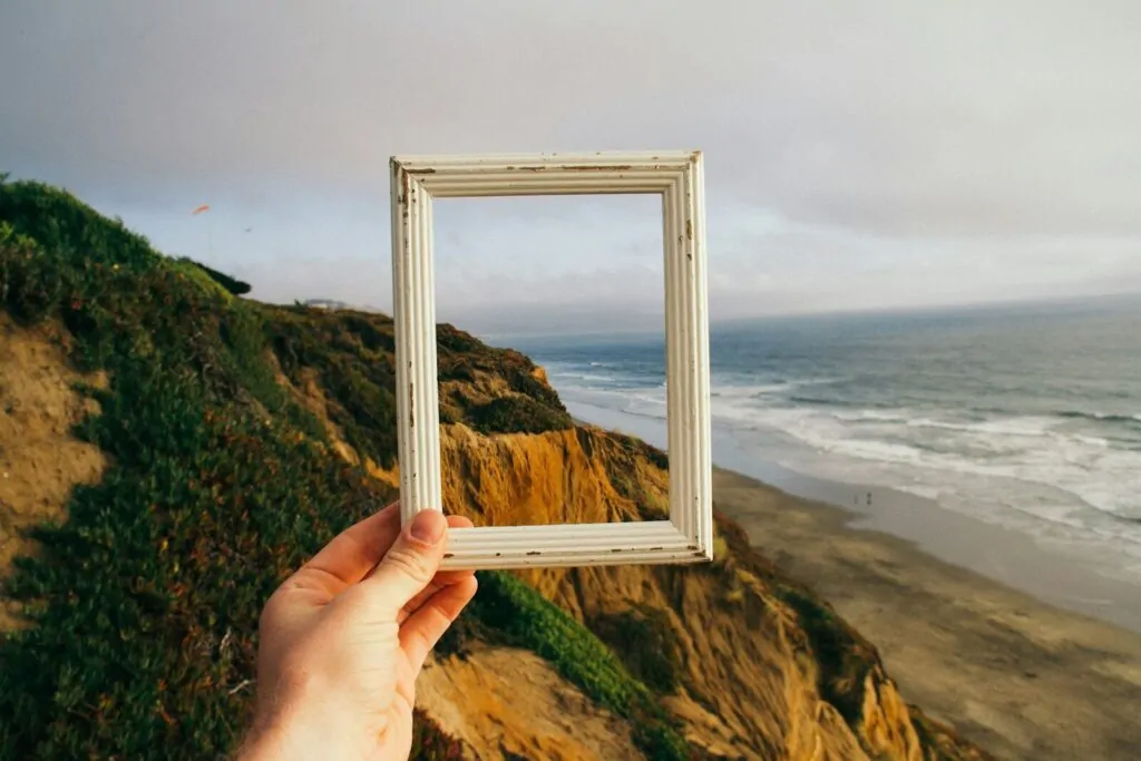 50 Good Habits That Can Improve Your Life Starting Today 12 person hand holding photo frame