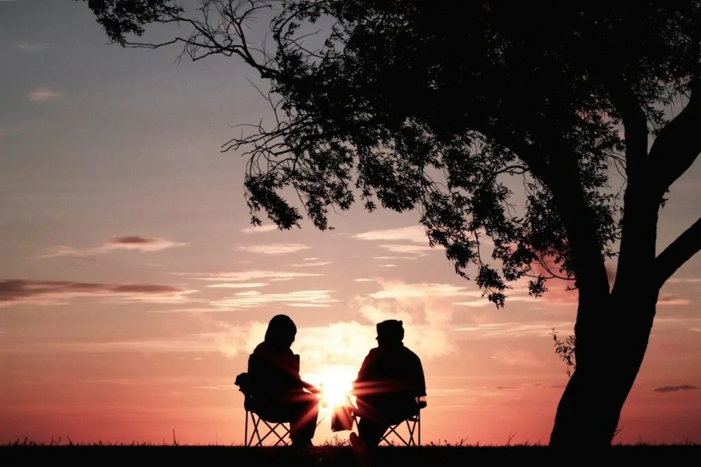 50 Good Habits That Can Improve Your Life Starting Today 11 silhouette of two person sitting on chair near tree