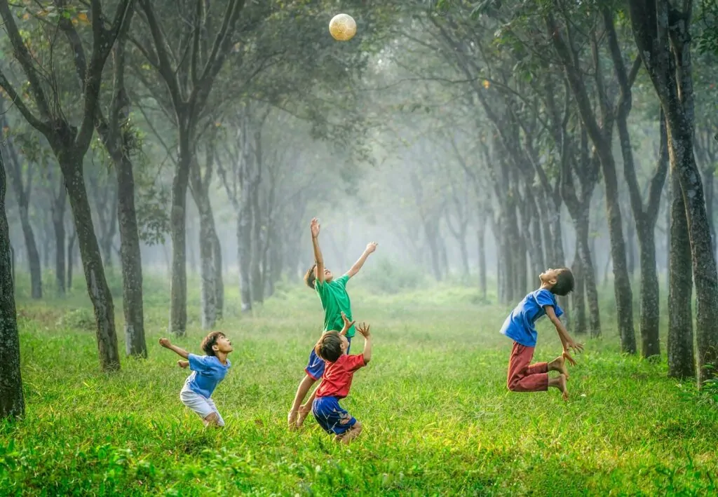 10 Low Screen Time Activities Kids Actually Love 2 four boy playing ball on green grass