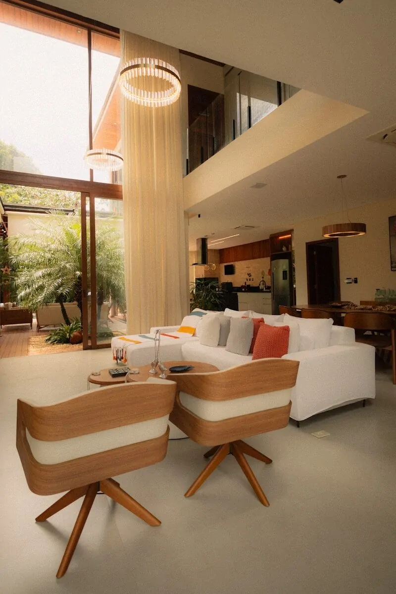 50 Luxury Living Room Ideas for Every Home Style 29 Modern living room with white sofa and wooden chairs.