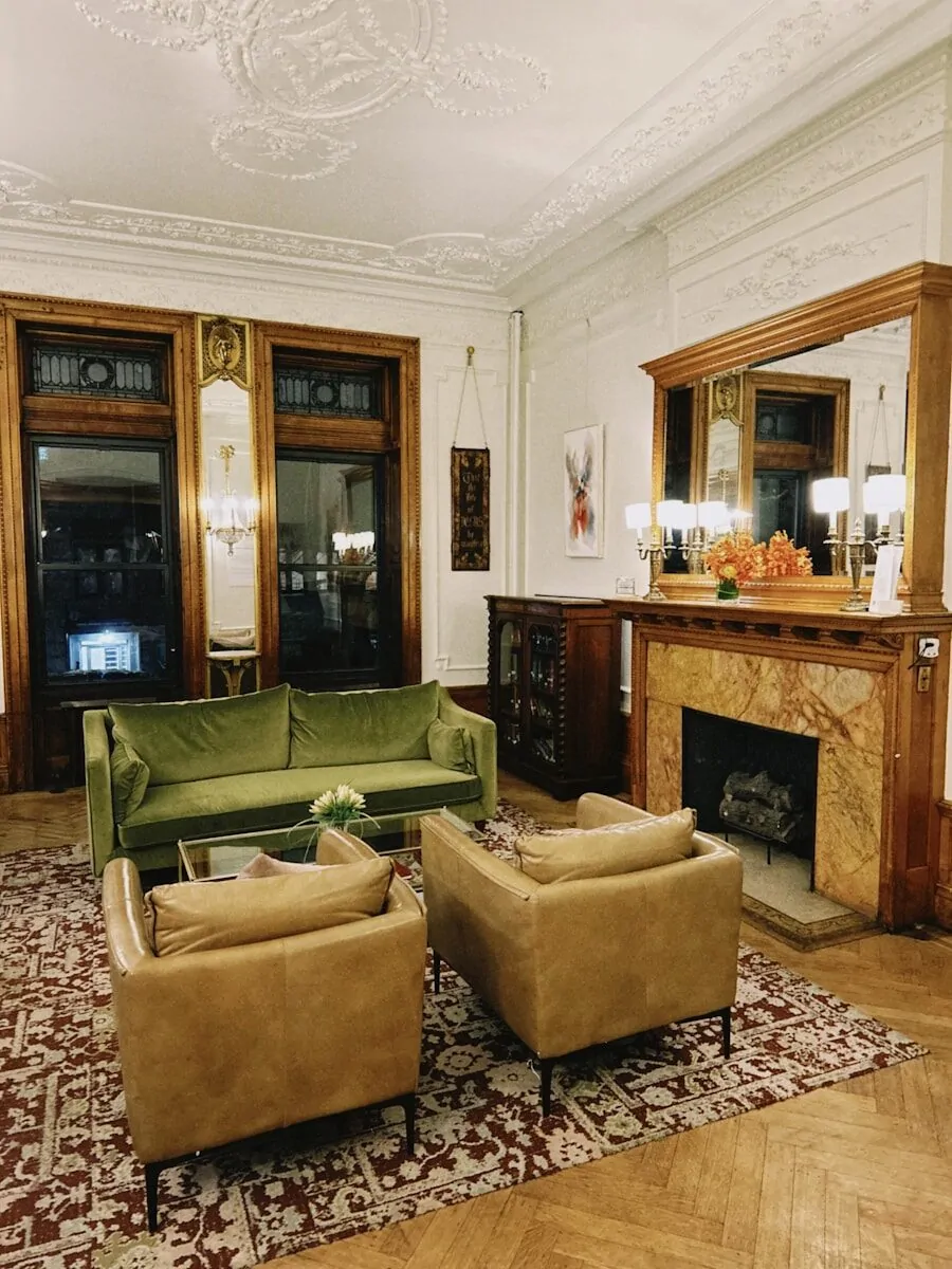 50 Luxury Living Room Ideas for Every Home Style 39 Elegant living room with green sofa and armchairs.