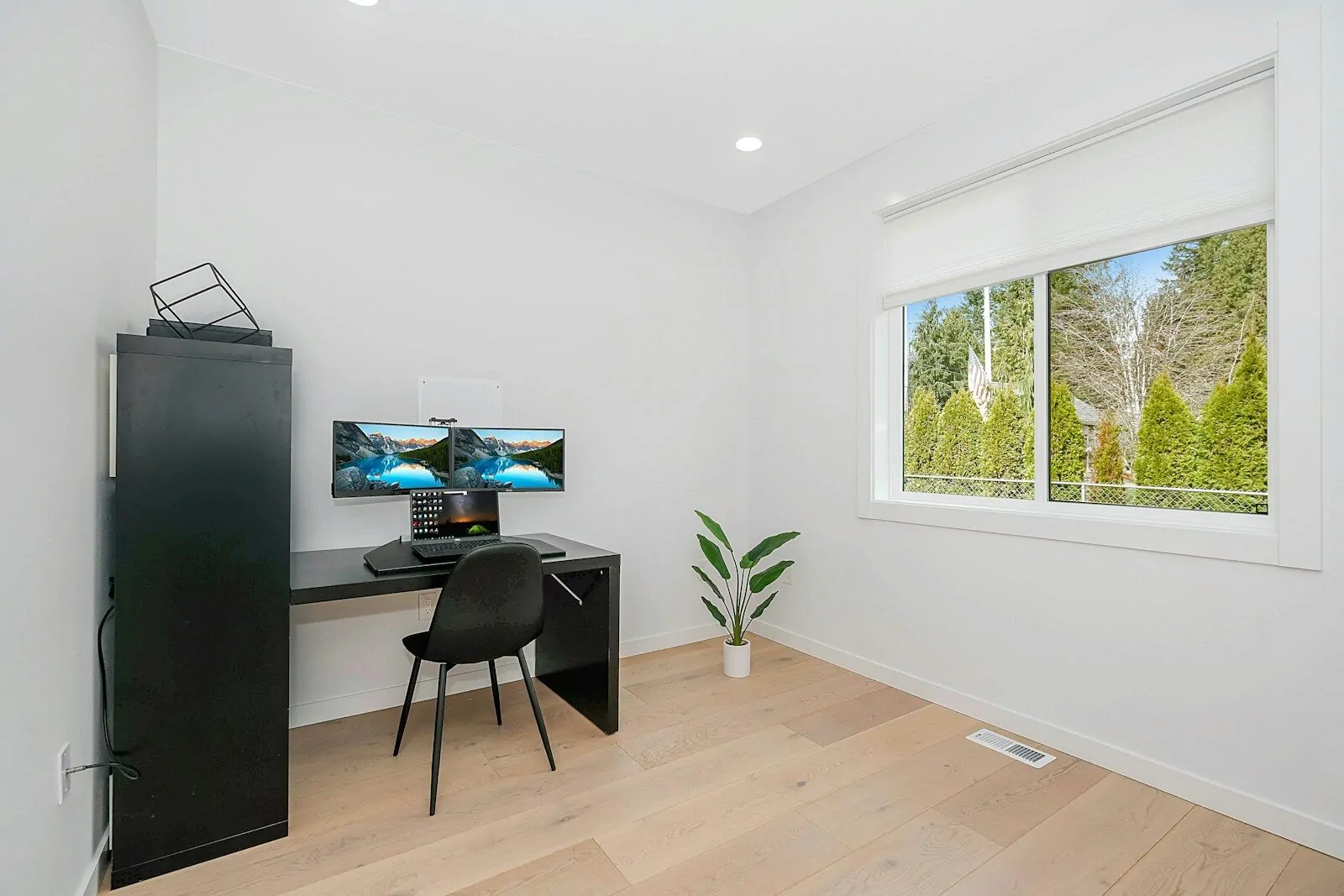 black flat screen tv on black wooden table