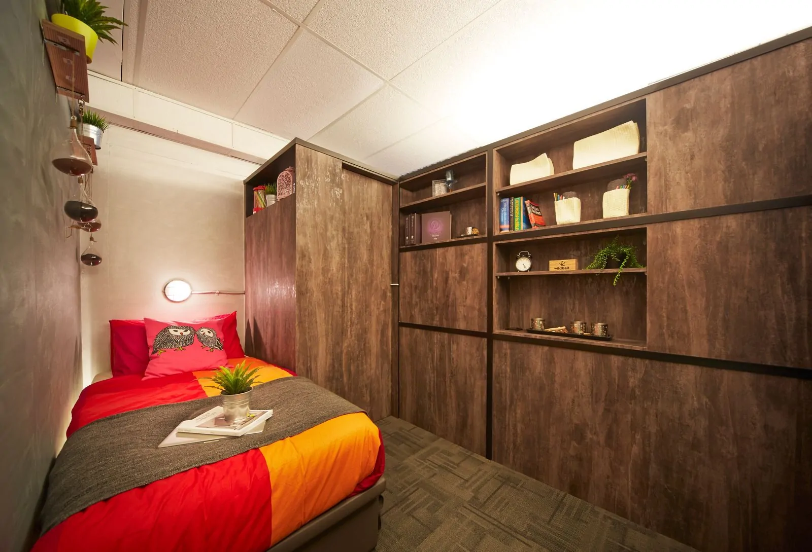35+ Room Decor Ideas for Small Spaces That Feel Bigger 11 Simple bedroom interior design with colorful bed and wooden cabinet along wall in house