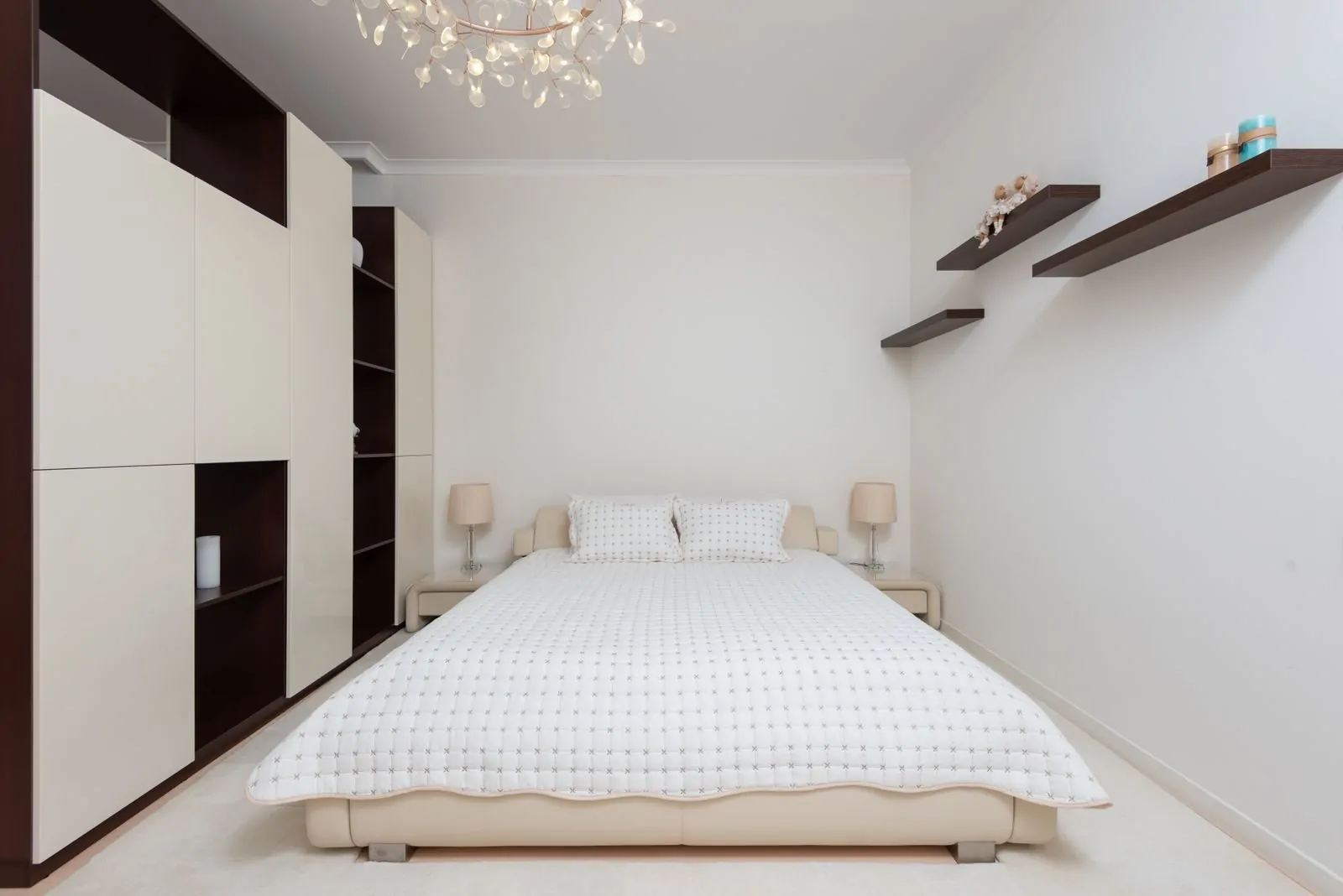 35+ Room Decor Ideas for Small Spaces That Feel Bigger 18 Interior of contemporary large bedroom with black shelves and bed with soft cushions
