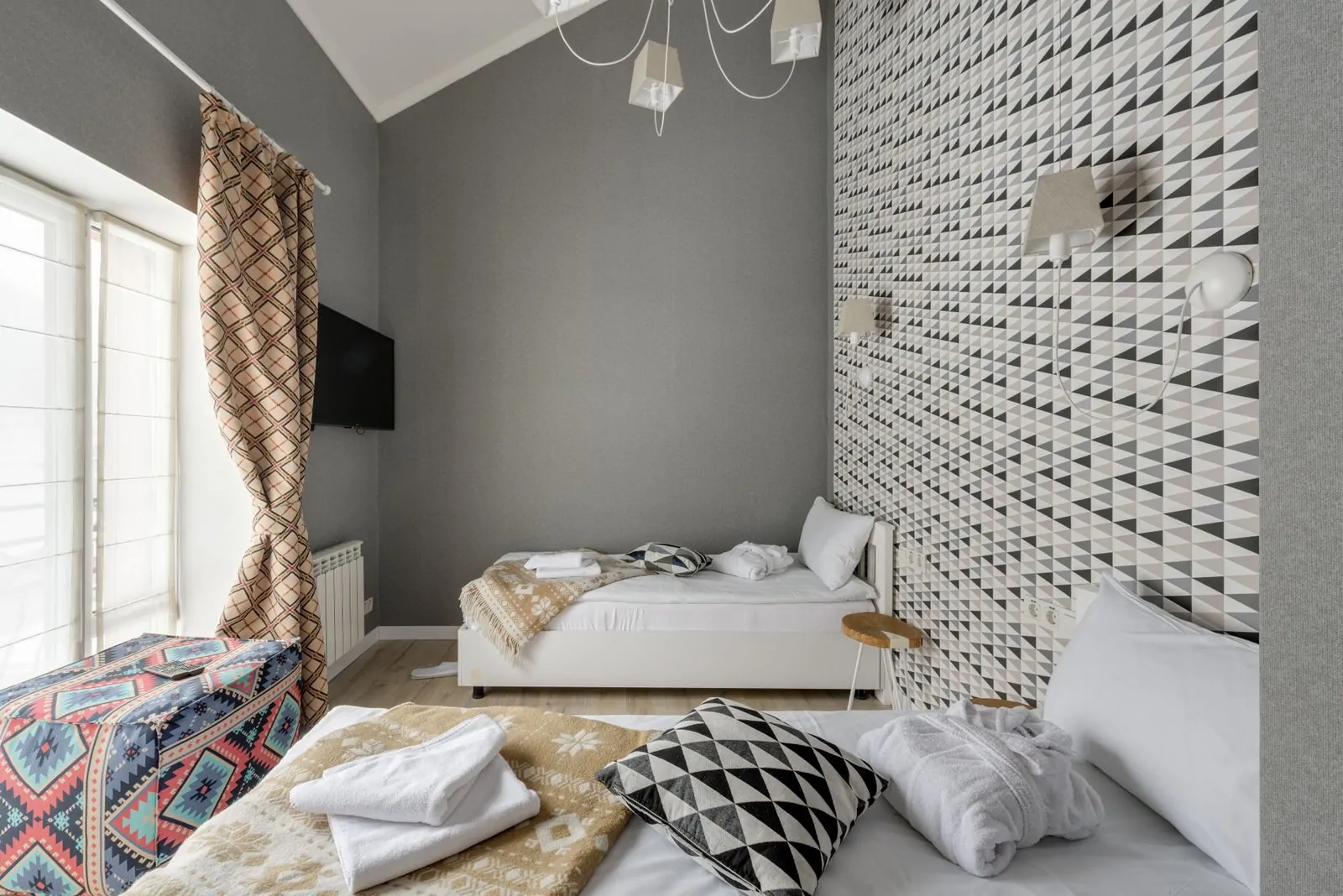 35+ Room Decor Ideas for Small Spaces That Feel Bigger 16 A stylish bedroom featuring geometric patterns and modern design elements.