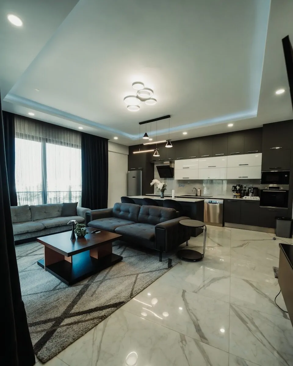 50 Luxury Living Room Ideas for Every Home Style 28 Modern living room and kitchen with dark furniture.