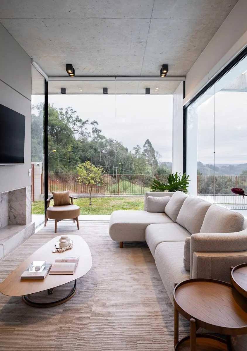 50 Luxury Living Room Ideas for Every Home Style 32 Modern living room with large windows overlooking nature