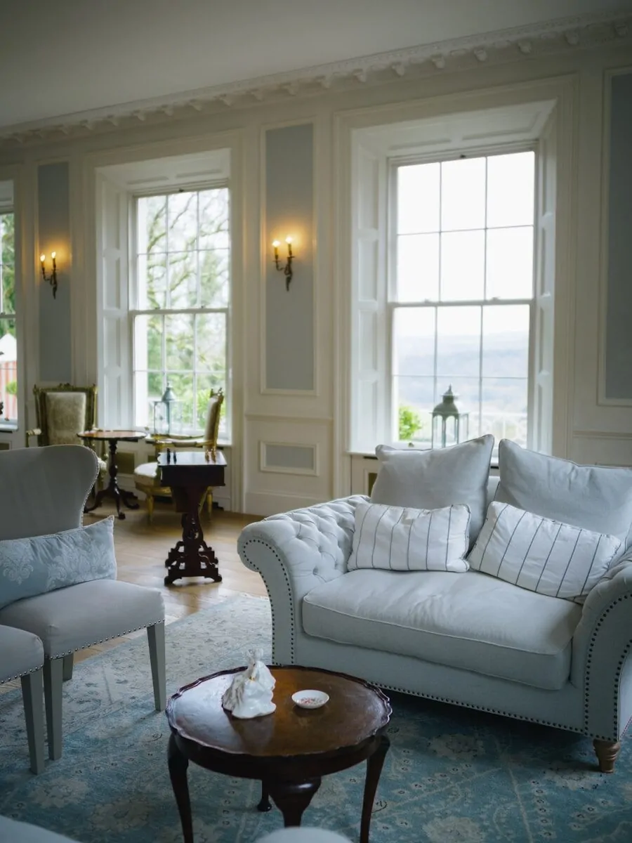 50 Luxury Living Room Ideas for Every Home Style 40 Elegant living room with plush sofa and large windows.