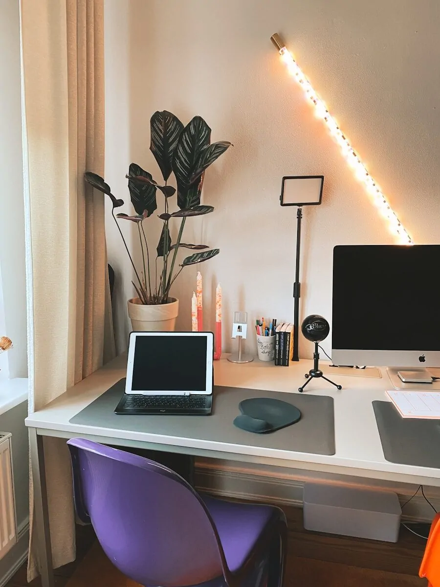 35+ Small Office Ideas for Working From Home 36 a desk with a laptop and a monitor on it