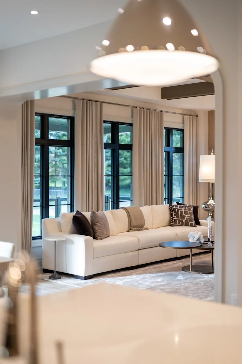 50 Luxury Living Room Ideas for Every Home Style 31 Modern living room with large sectional sofa and windows.