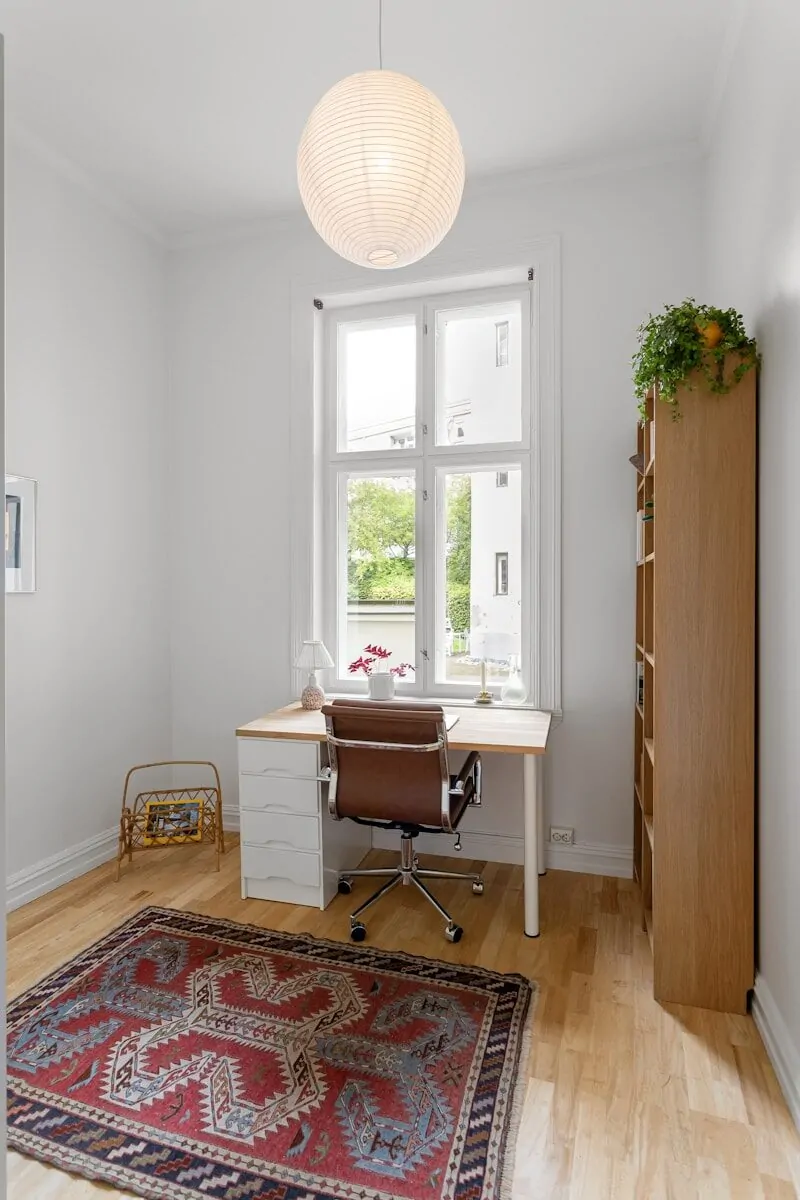 35+ Small Office Ideas for Working From Home 14 A room with a rug, a desk and a window