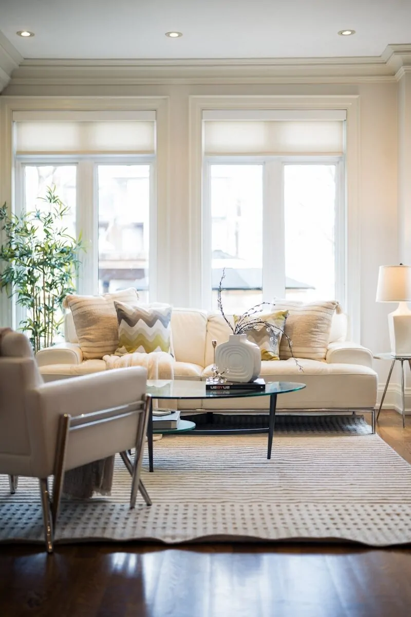 50 Luxury Living Room Ideas for Every Home Style 37 A bright, modern living room with a sofa and armchair.