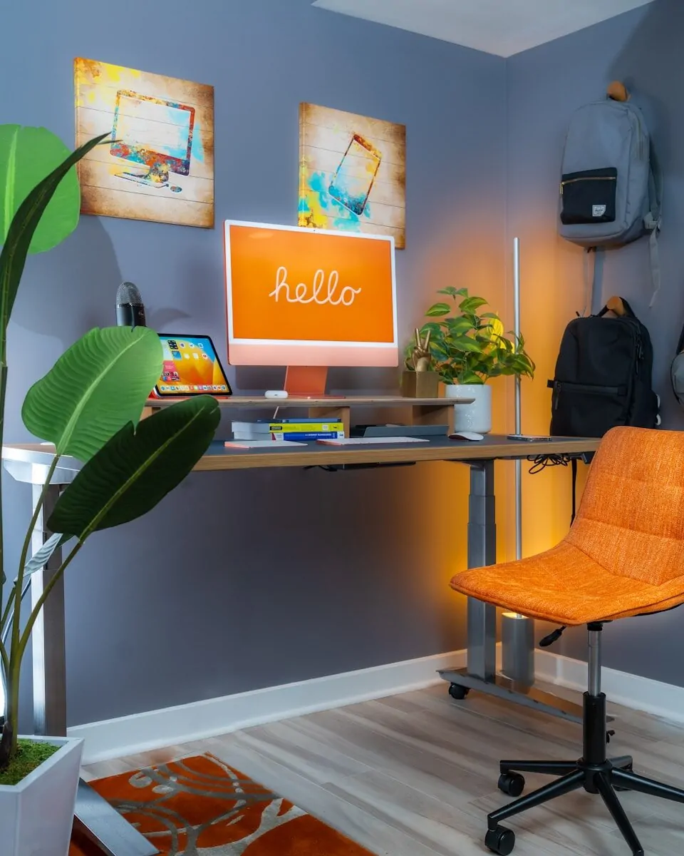 35+ Small Office Ideas for Working From Home 24 a desk with a computer and a chair in a room