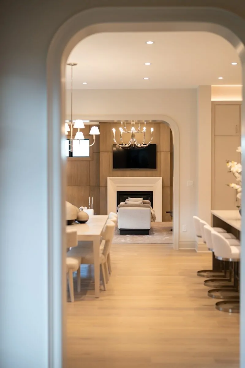 50 Luxury Living Room Ideas for Every Home Style 47 Contemporary living room with fireplace, dining table, and kitchen island.
