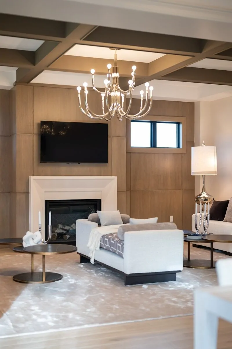 50 Luxury Living Room Ideas for Every Home Style 36 Elegant living room featuring a fireplace, tv, and stylish chandelier.