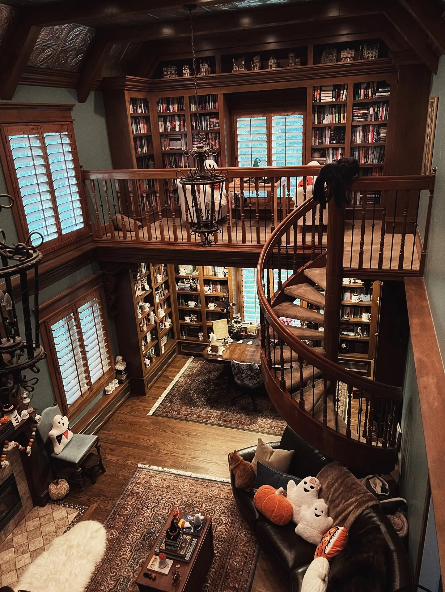 10 Home Library Ideas That Will Make You Want to Stay Home 28 Two-Story Gothic Loft Library with Spiral Staircase