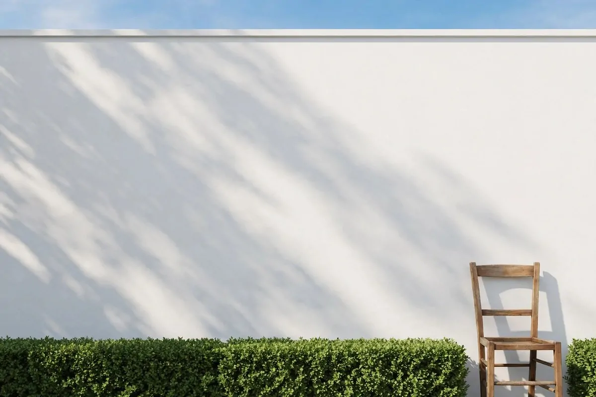 White garden wall with a chair for Outdoor Photo Studio Ideas