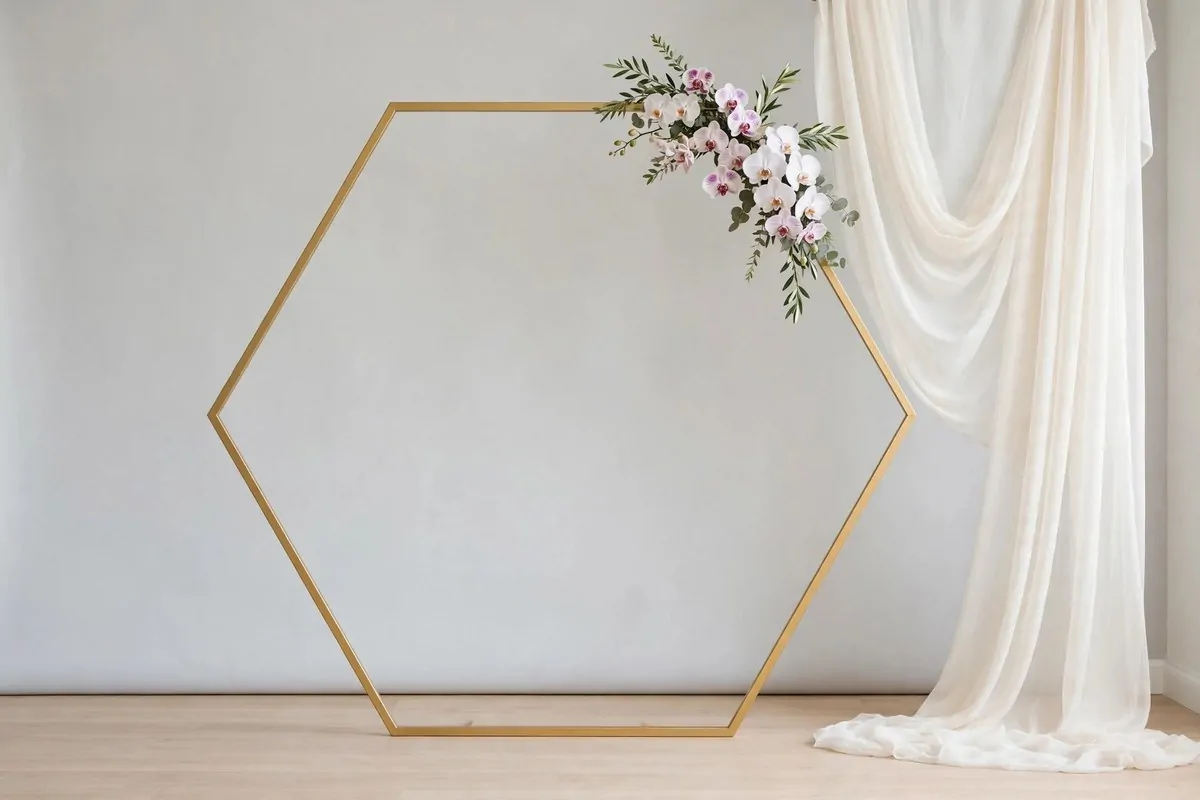 Gold geometric frame for Wedding Photo Studio Ideas: modern hexagonal arch with minimal florals