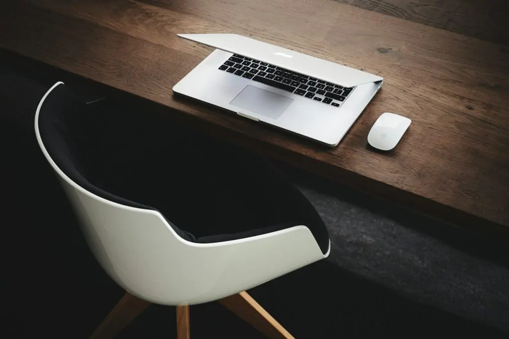 Am I a Workaholic Quiz: 10 Quick Questions That Reveal If Work Runs Your Life 1 Apple MacBook beside computer mouse on table
