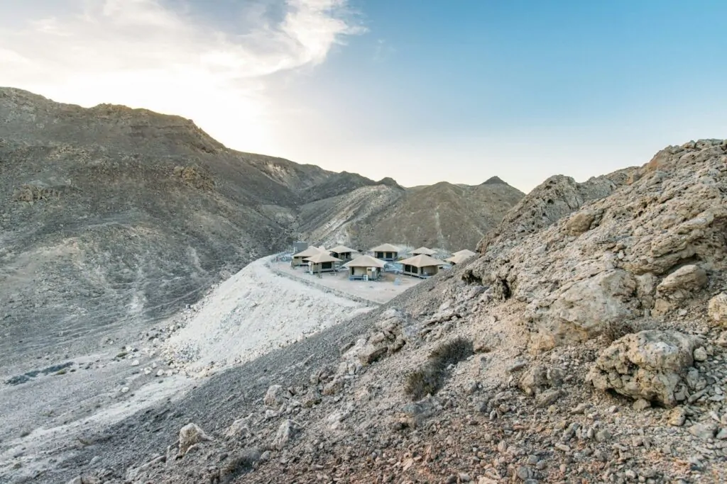 Can You Name the Countries That Start With O? Only 1 Exists 1 Buildings in a dry, rocky mountain valley