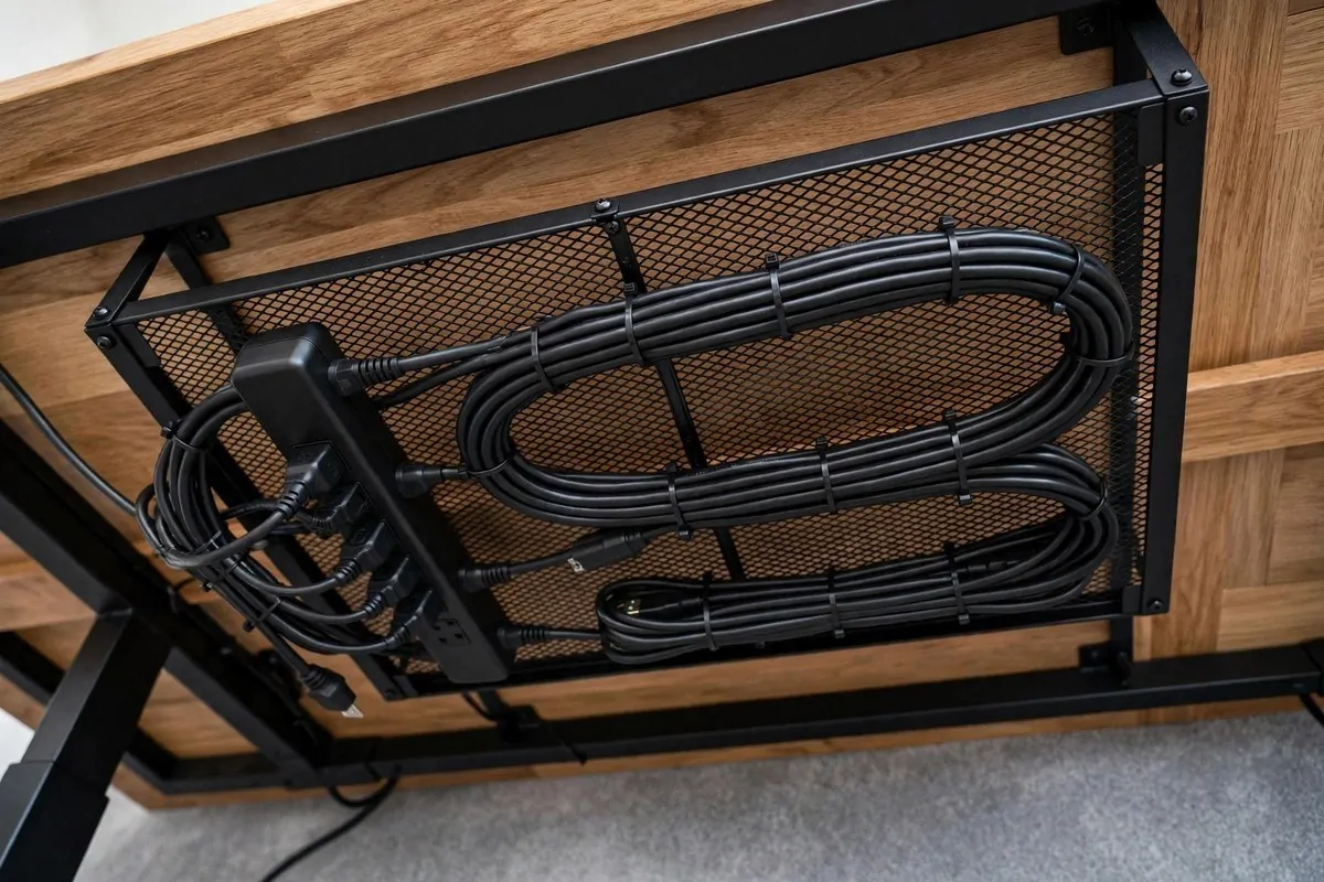 How to Organize My Home Office for Productivity 3 Cables bundled neatly under a desk with a cord tray