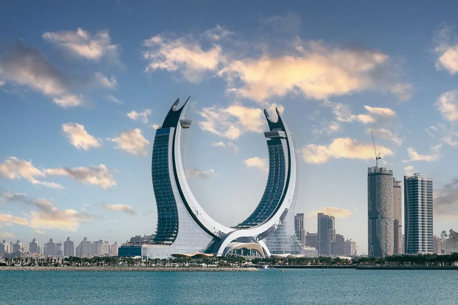 Only 1 Country Starts With Q, Do You Know It? Take This Quick Quiz! 1 The crescent-shaped Katara Towers rising above the waterfront in Lusail, Qatar