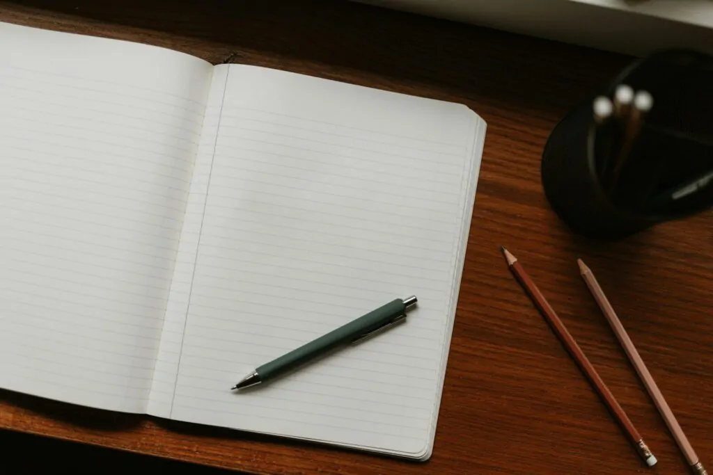 Am I Honest Quiz: Answer 10 Truthful Questions and Find Out How Honest You Really Are 1 Open notebook with pen and pencils on desk