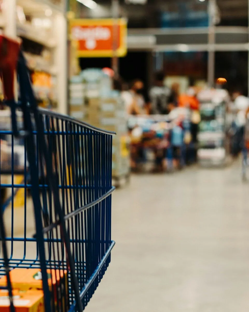 23 World-Famous Brands Are Hiding in Plain Sight - How Many of These Famous Brands Can You Name? 1 A shopping cart in a store aisle, surrounded by famous brands