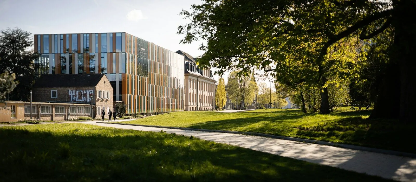 Should I Go To College? Take This Honest Quiz To Find Out If It Is Right For You 1 A large building sitting on top of a lush green field
