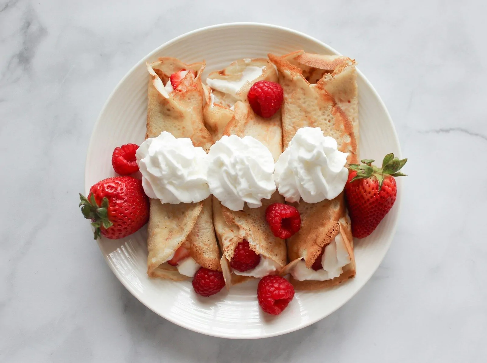 Can You Name These Popular Desserts? A Sweet Quiz For Dessert Lovers! 1 strawberry and banana on white ceramic plate