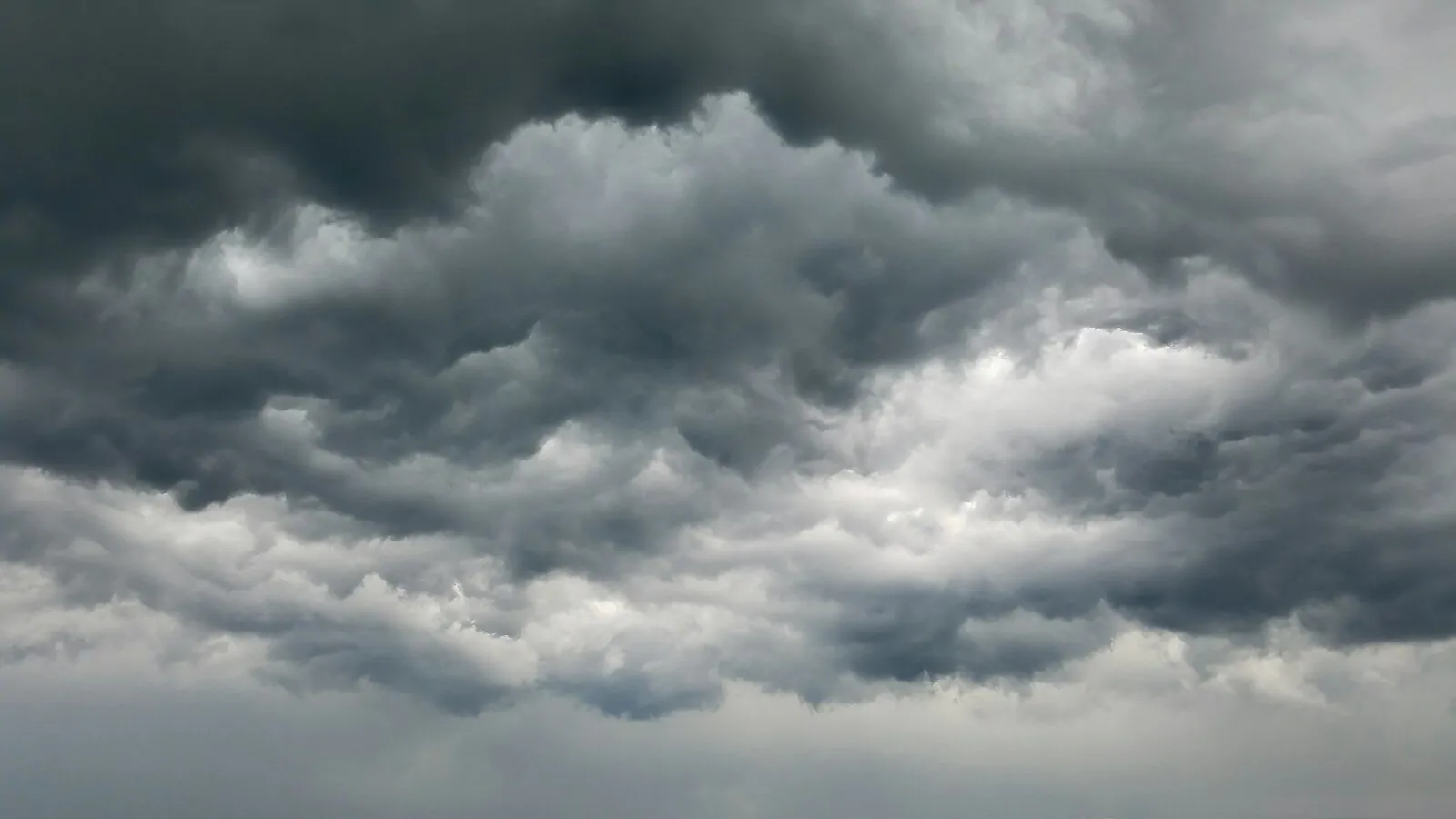 Am I a Pessimist Quiz: Answer 10 Honest Questions and Find Out If You Always Expect the Worst 1 Dense dark grey storm clouds filling the sky