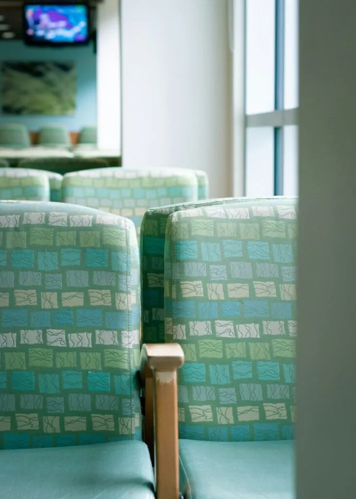 Am I Socially Awkward Quiz: Answer 10 Fun Questions and Find Out How You Really Act Around People 1 green and white sofa chair